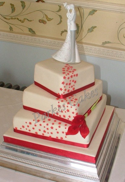 three tier twisted square wedding cake with cascading stars