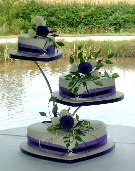 Three Tier Heart Wedding Cake with Roses, Purple Gerberras and Lisianthus Buds