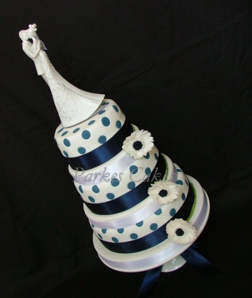 three tier navy polka dot wedding cake
