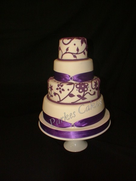 four tier purple applique wedding cake