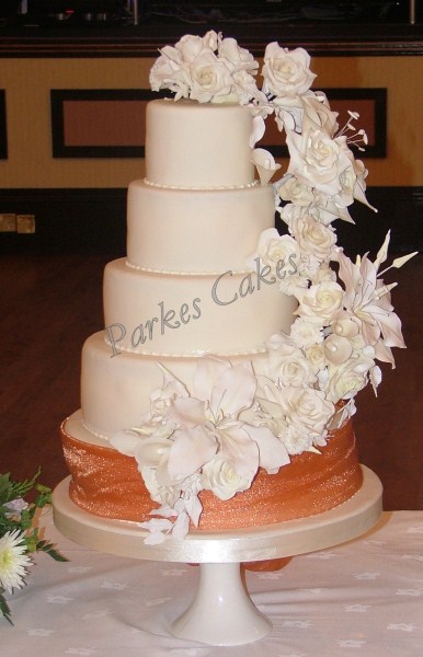 five tier ivory wedding cake with cascading sugar flowers