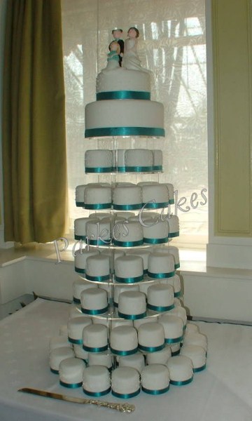 teal mini cake wedding cake tower with bride and groom tower