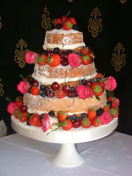 three tier victoria sponge wedding cake with fresh fruit and flowers
