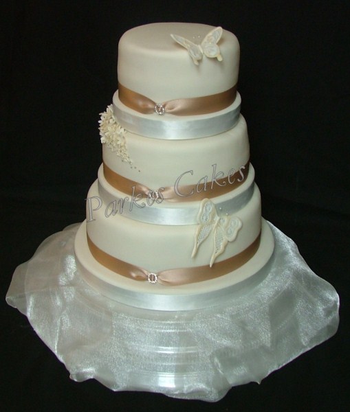 three tier ivory wedding cake with royal iced butterflies