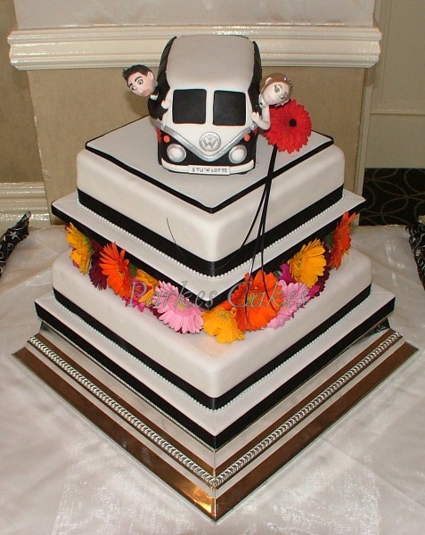 two tier square wedding cake with camper van topper