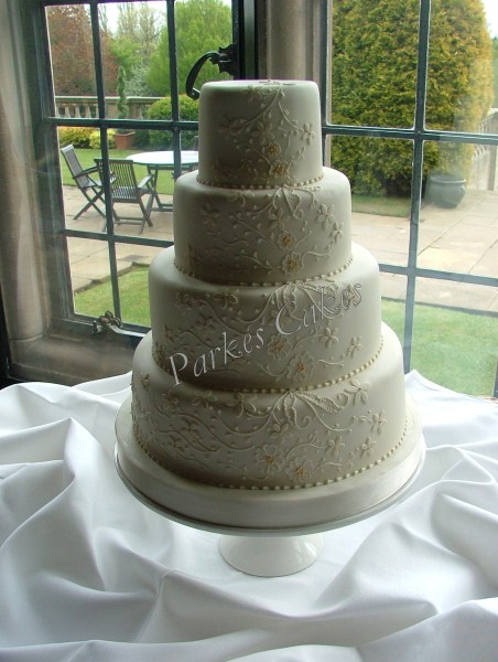 four tier ivory lace wedding cake