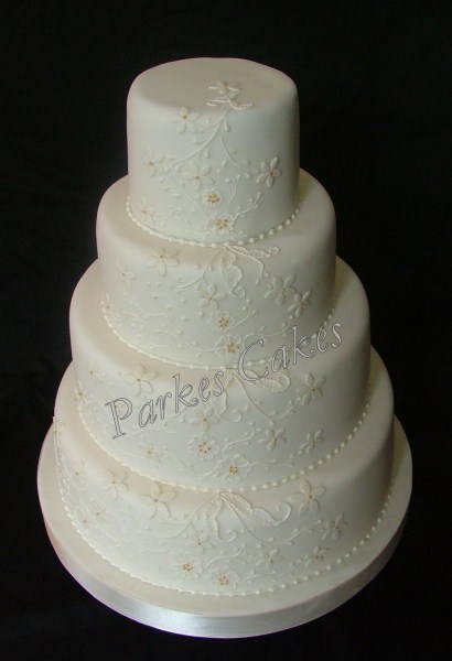 four tier ivory lace wedding cake