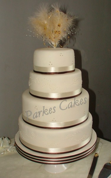 four tier coffe and cream wedding cake
